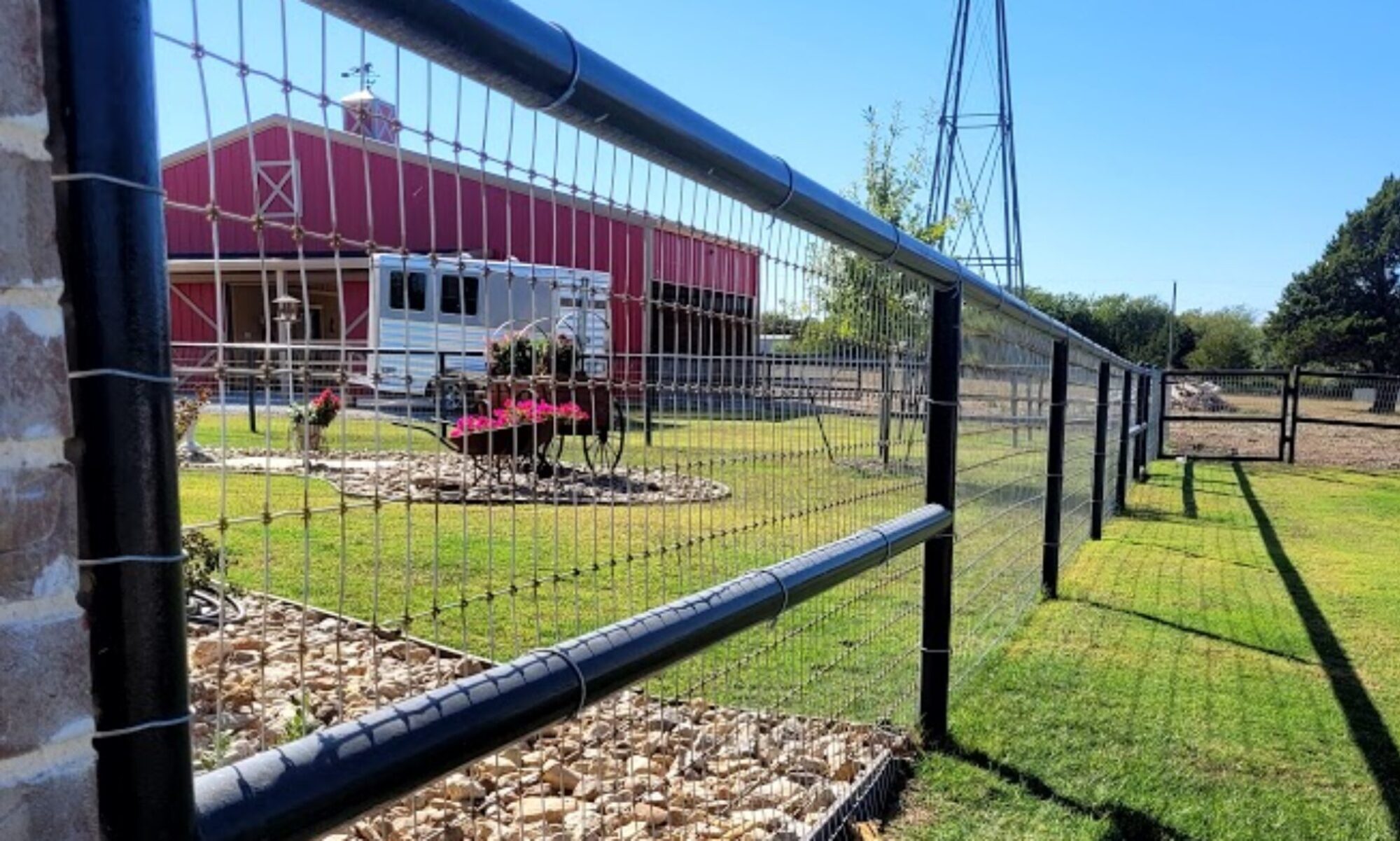 top-rail pipe fence with non-climb wire